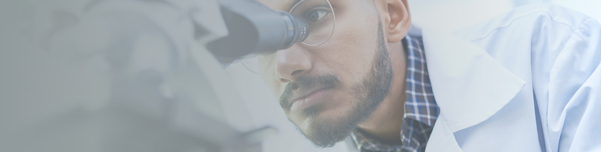A shelf of pill boxes with someone pulling one box out