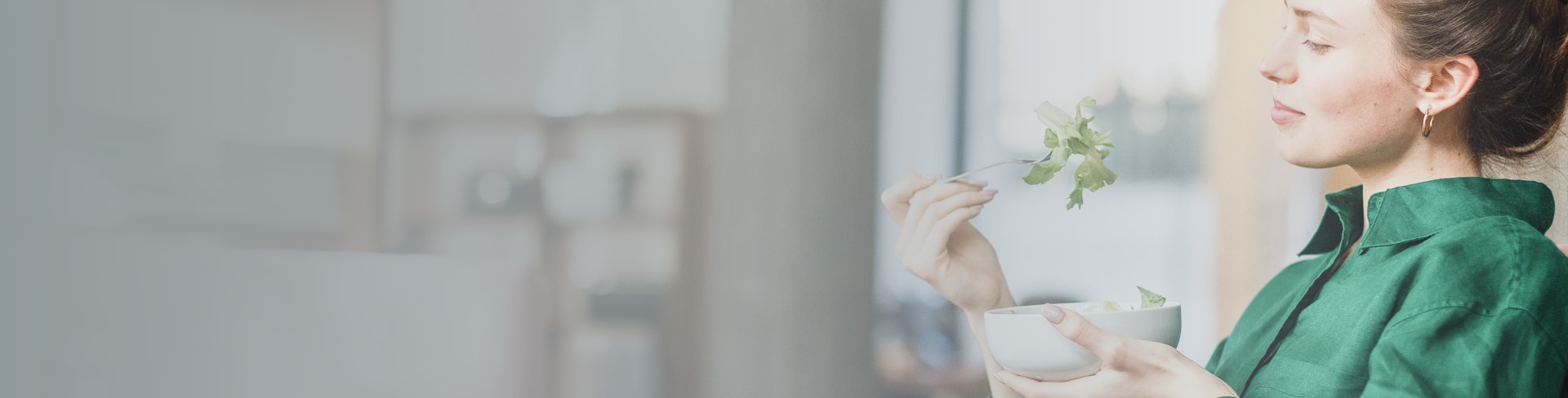 A shelf of pill boxes with someone pulling one box out