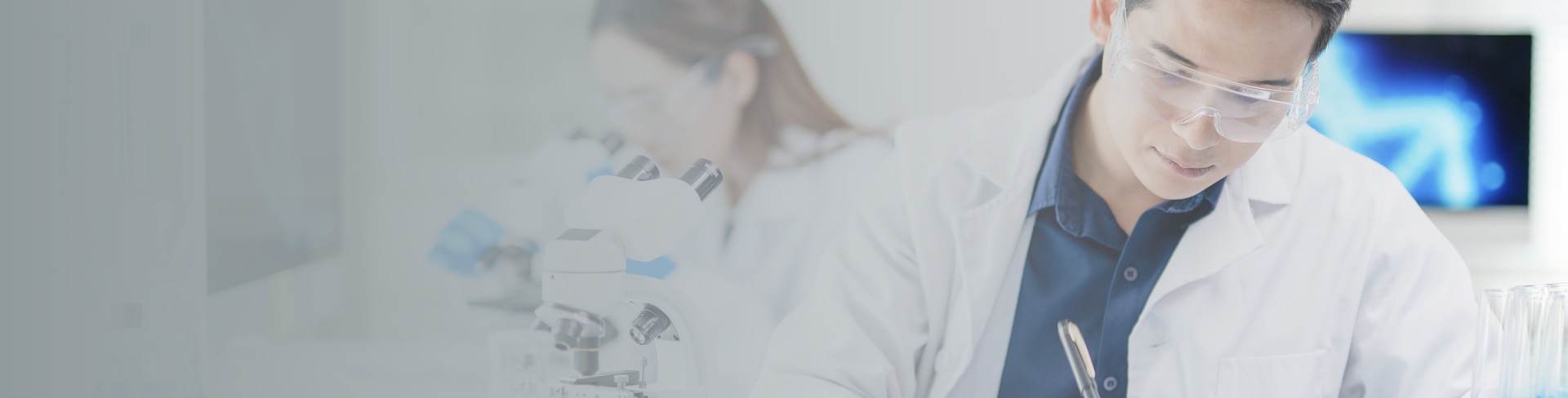 A shelf of pill boxes with someone pulling one box out